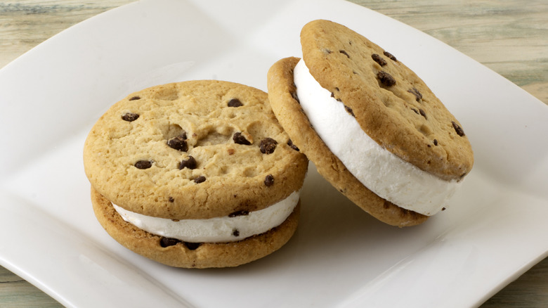 A chocolate chip cookie ice cream sandwich melting slightly