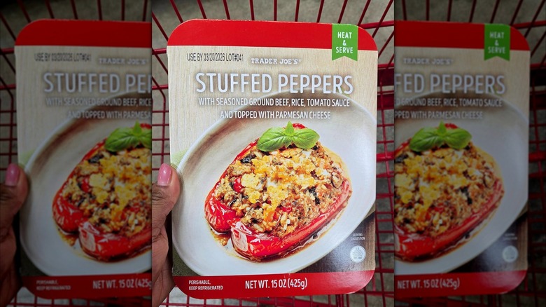 Person holding a box of Trader Joe's Stuffed Peppers