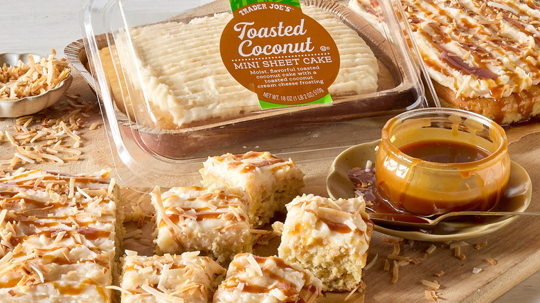 Trader Joe's Coconut Sheet Cake in a box with slices pieces around it and a bowl of caramel sauce