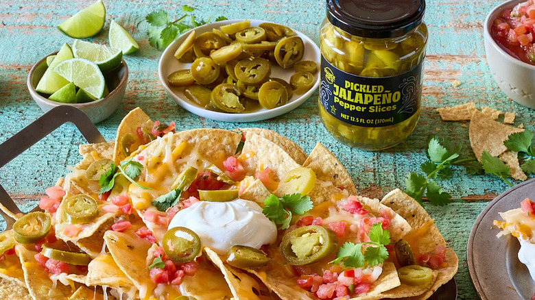 Traer Joe's Pickled Jalapeño Pepper Slices on a table with prepared nachos