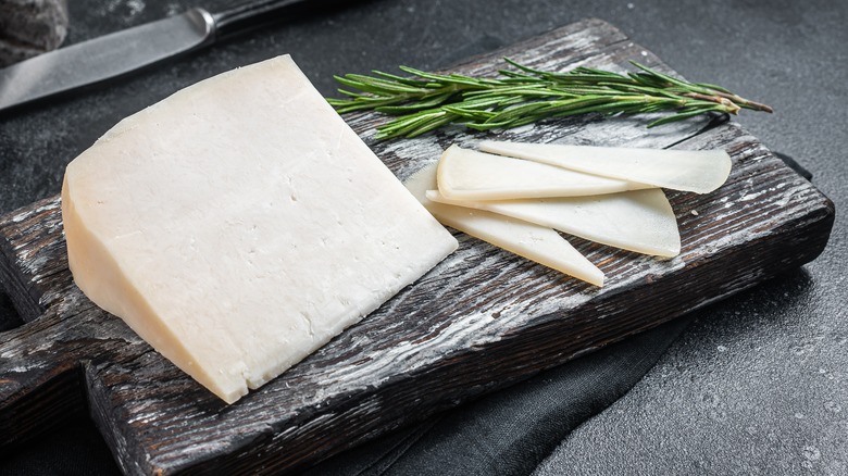 goat cheese on cutting board with knife
