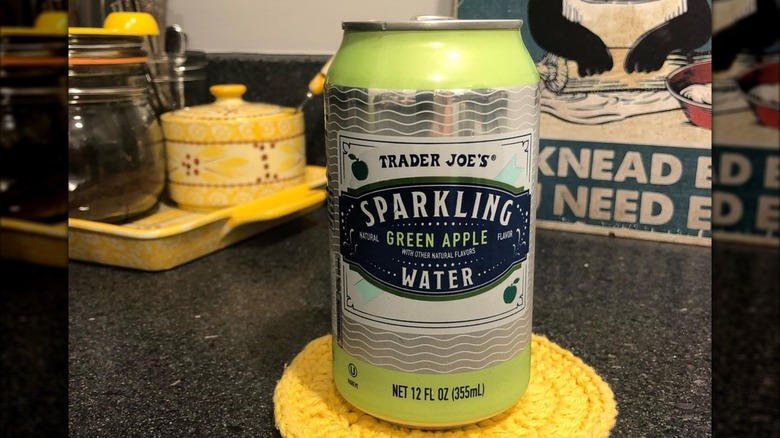 A can of Trader Joe's Green Apple Sparkling Water sitting on a kitchen counter