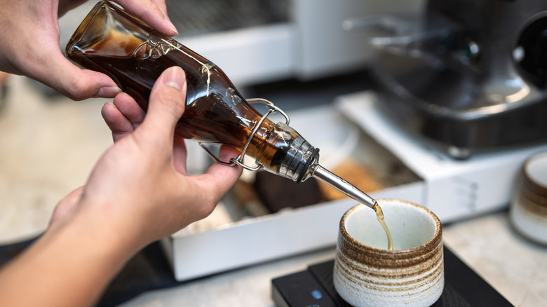 adding sauce to coffee