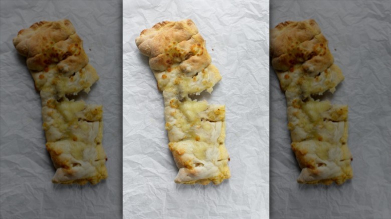 cheesy bread on parchment paper