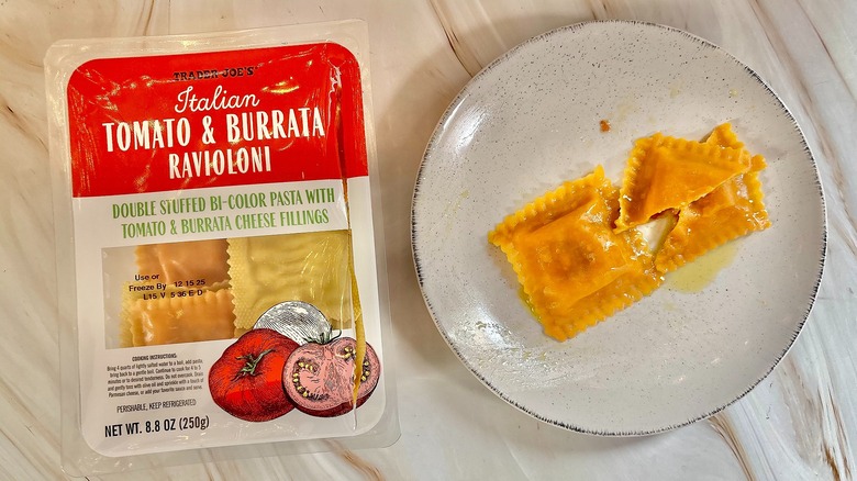 Trader Joe's Tomato & Burrata Ravioloni on white plate next to package