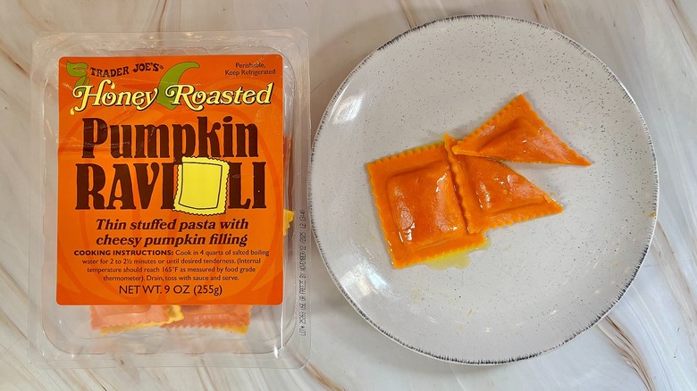 Trader Joe's Honey Roasted Pumpkin Ravioli on white plate next to package