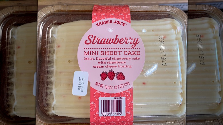 A cake with frosting and strawberries