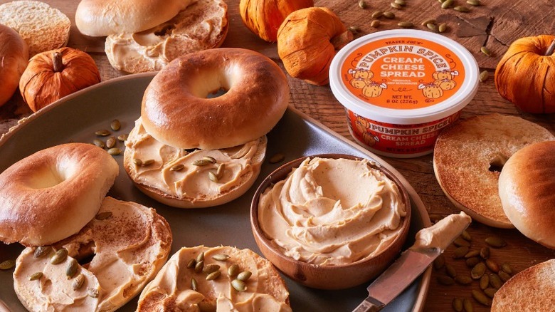 Trader Joe's Pumpkin Spice Cream Cheese Spread container and a plate of bagels