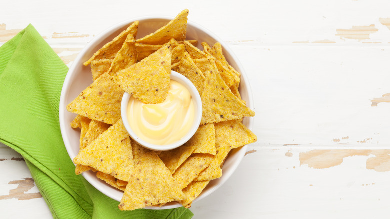 Nacho cheese in chip bowl
