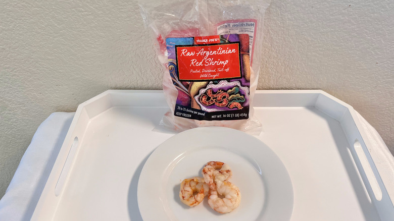 Trader Joe's Argentinian red shrimp on plate with the whole bag placed in the back against the wall