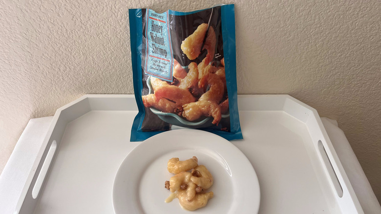 Honey walnut shrimp pack from Trader Joe's with some cooked shrimp served on a plate