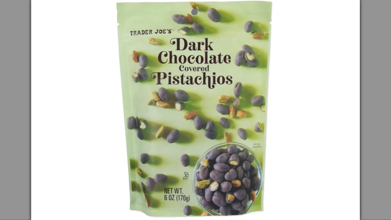 Bag of Trader Joe's dark chocolate covered pistachios on white background