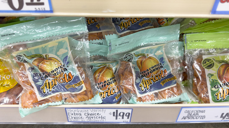 Bags of dried apricots on shelf at Trader Joe's
