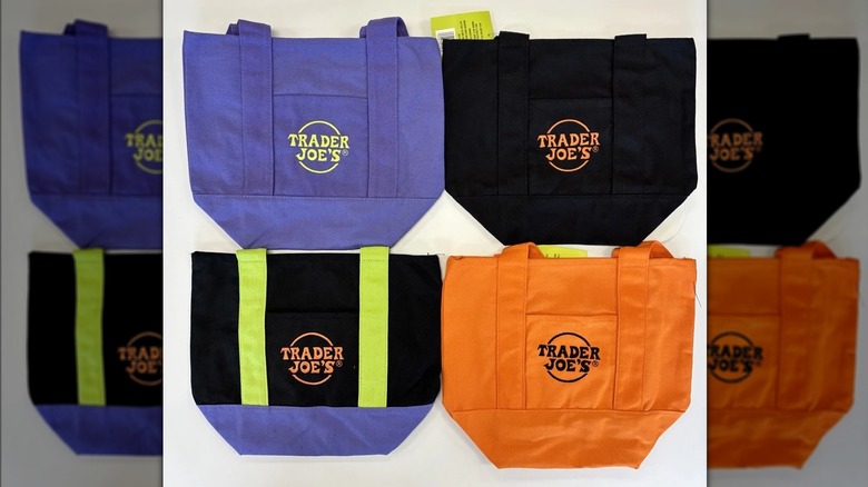 Four Halloween themed Trader Joe's miniature tote bags in purple, black, orange, and black and purple colors