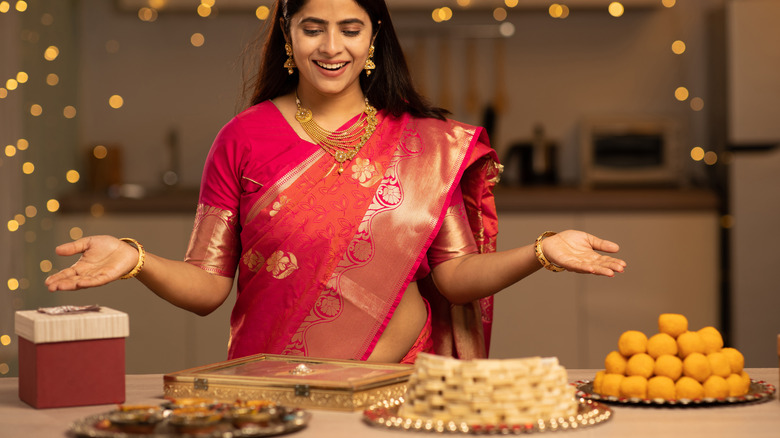 Woman looking at sweets on Diwali 