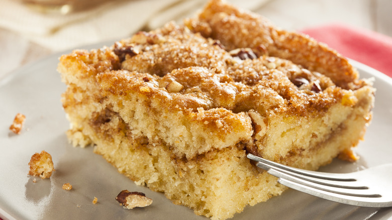 A slice of spiced cinnamon cake with nuts
