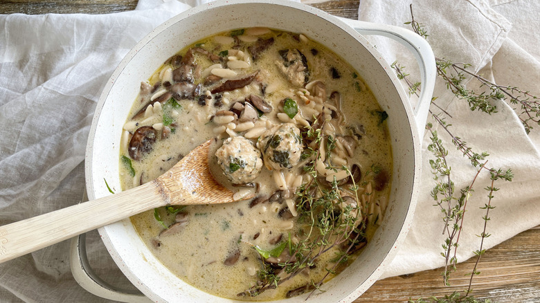 Turkey meatballs in mushroom soup with orzo and herbs