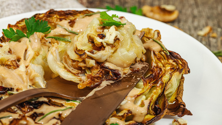 Close-up on cabbage steak with creamy sauce