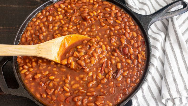Pan of baked beans with spoon
