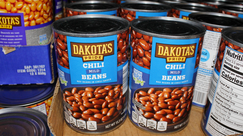 Cans of chili stacked together