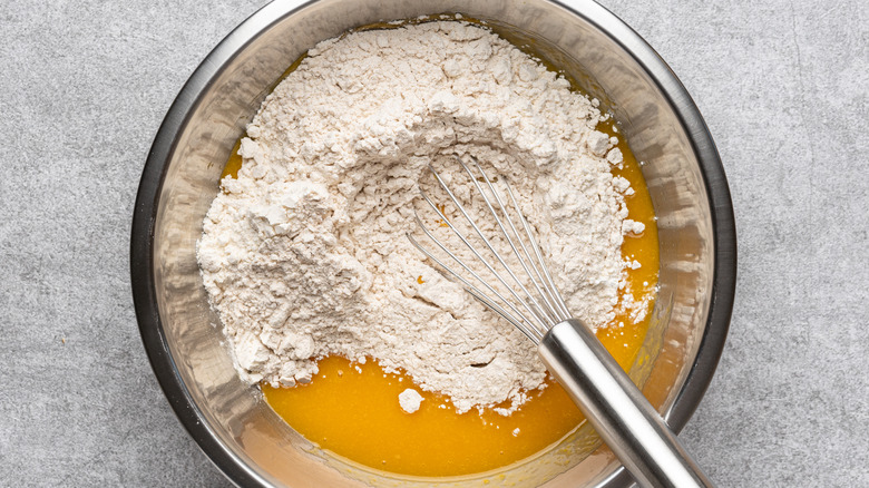 pumpkin puree with cake mix in a bowl