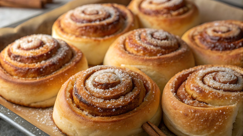 closeup of cinnamon rolls on a baking sheet