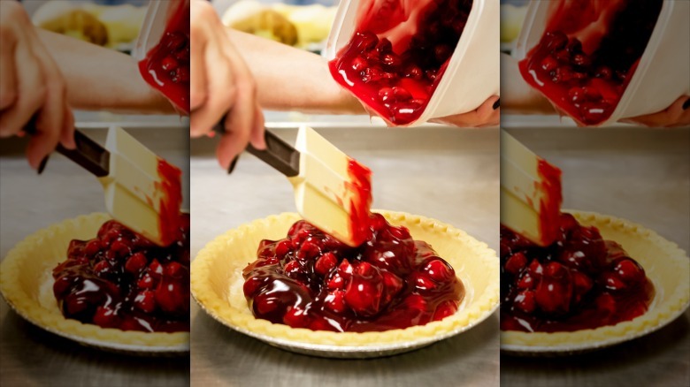 cherry pie filling spooned out of a container