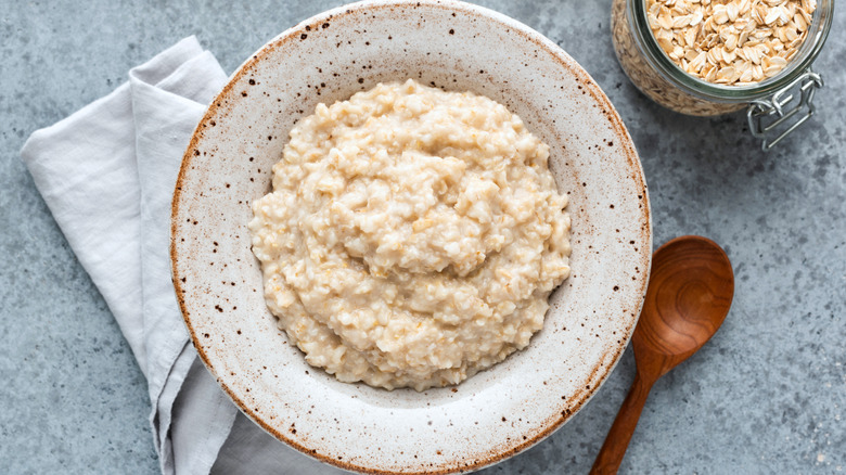 bowl of oatmeal with napkin and spoon