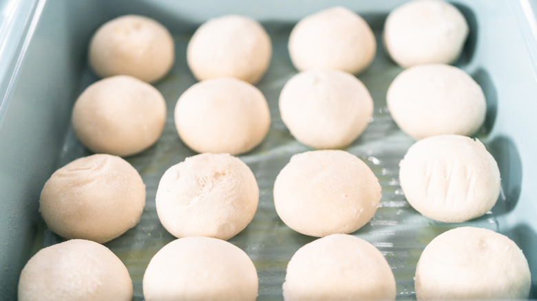 dinner rolls displayed on sheet