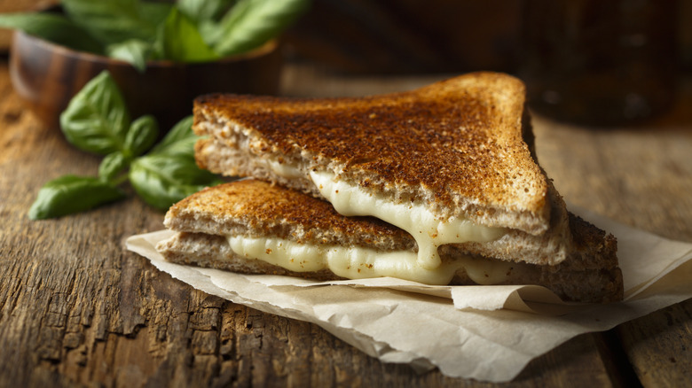 A grilled cheese sandwich sliced in half