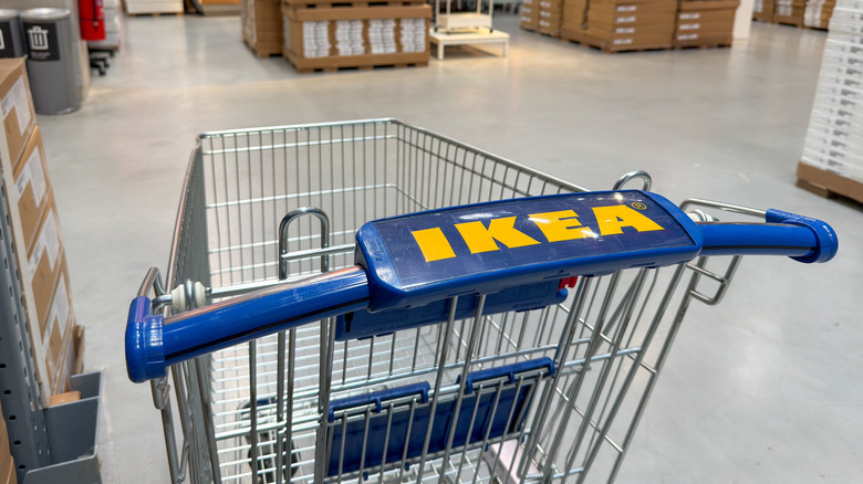 An empty Ikea shopping cart in the store's warehouse section