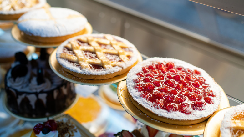 bakery display case with different fruit pies