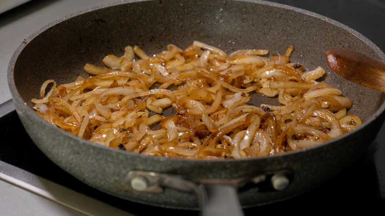 Onions caramelizing in a hot skillet