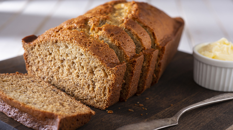 Banana bread with butter and knife