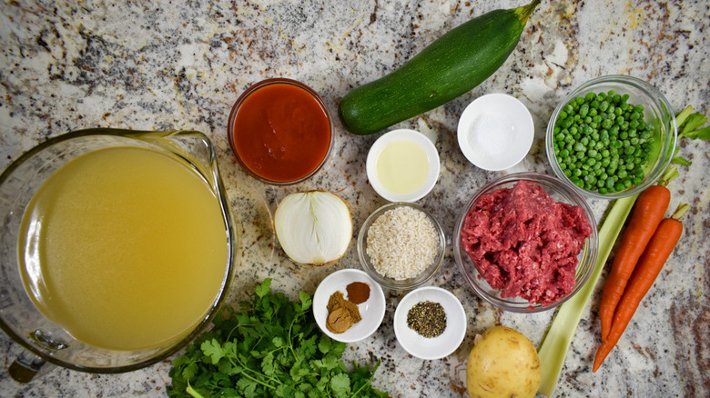Ingredients for albondigas sitting on a marble counter