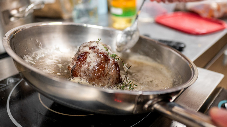 butter basting a steak