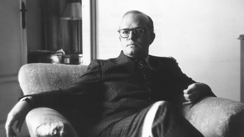 Truman Capote in chair