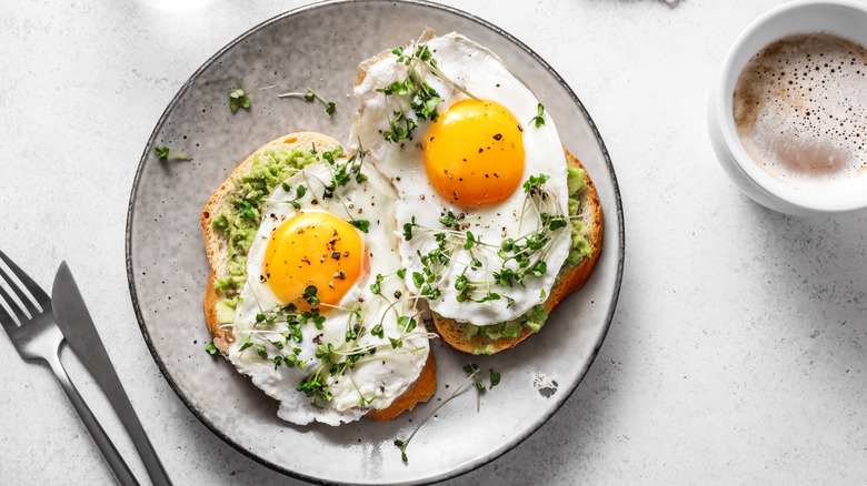 Fried eggs and greens on toast