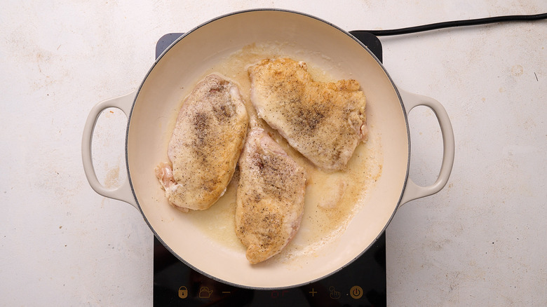 chicken browned in a skillet