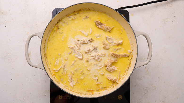 cream and chicken in a pot