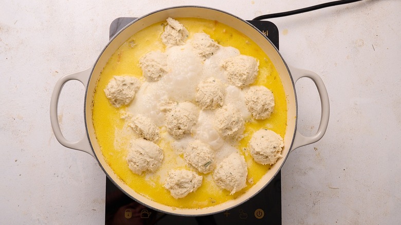 dumplings dropped into chicken broth