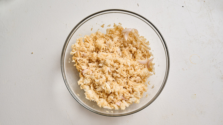 rice combined with flavoring ingredients in a bowl