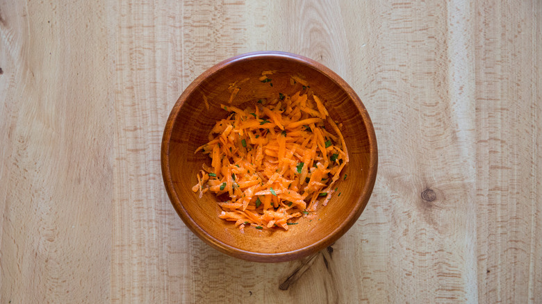 carrot salad in wooden bowl