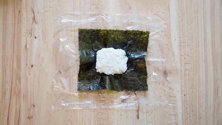 partially-made onigirazu on table