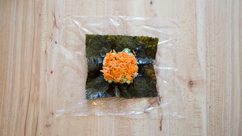 partially-made onigirazu on table