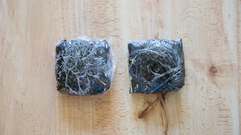 2 wrapped onigirazu on table