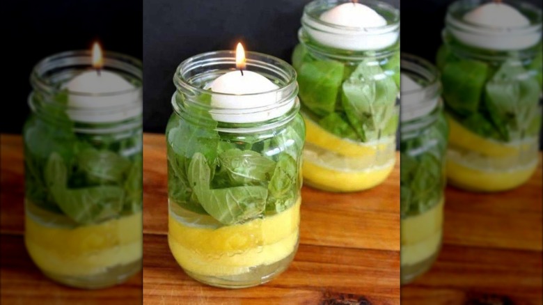 Jars with herbs, lemons, and candles