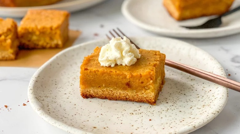 Pumpkin gooey butter cake with whipped cream