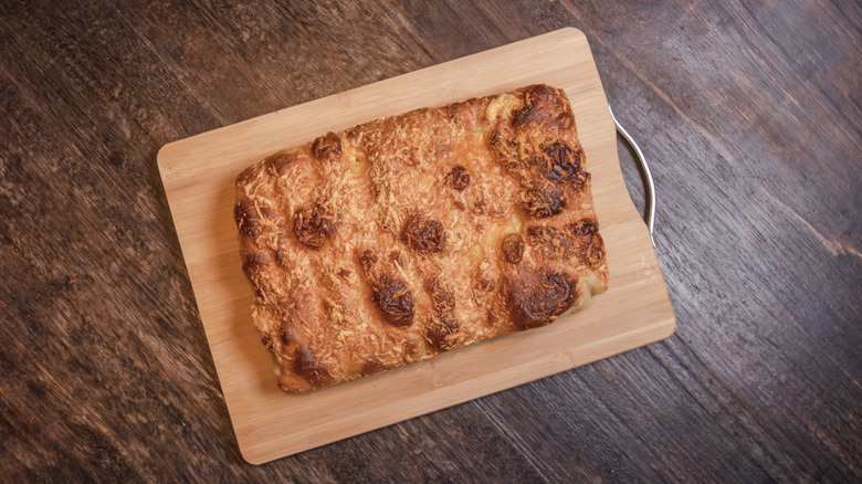 Cinnamon focaccia on wood board