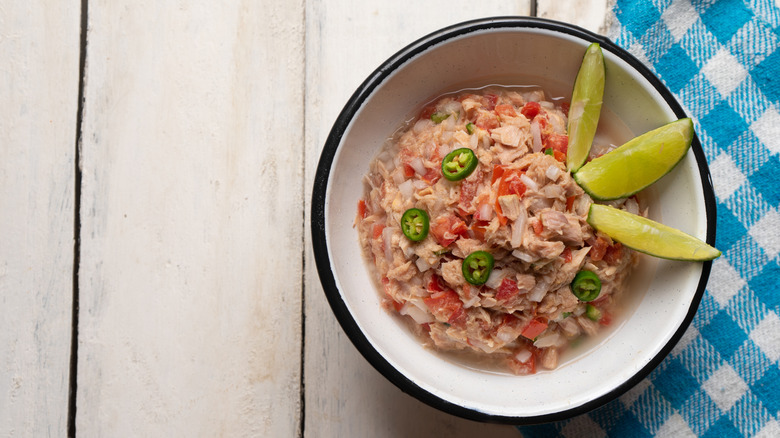 Canned tuna ceviche garnished with lime